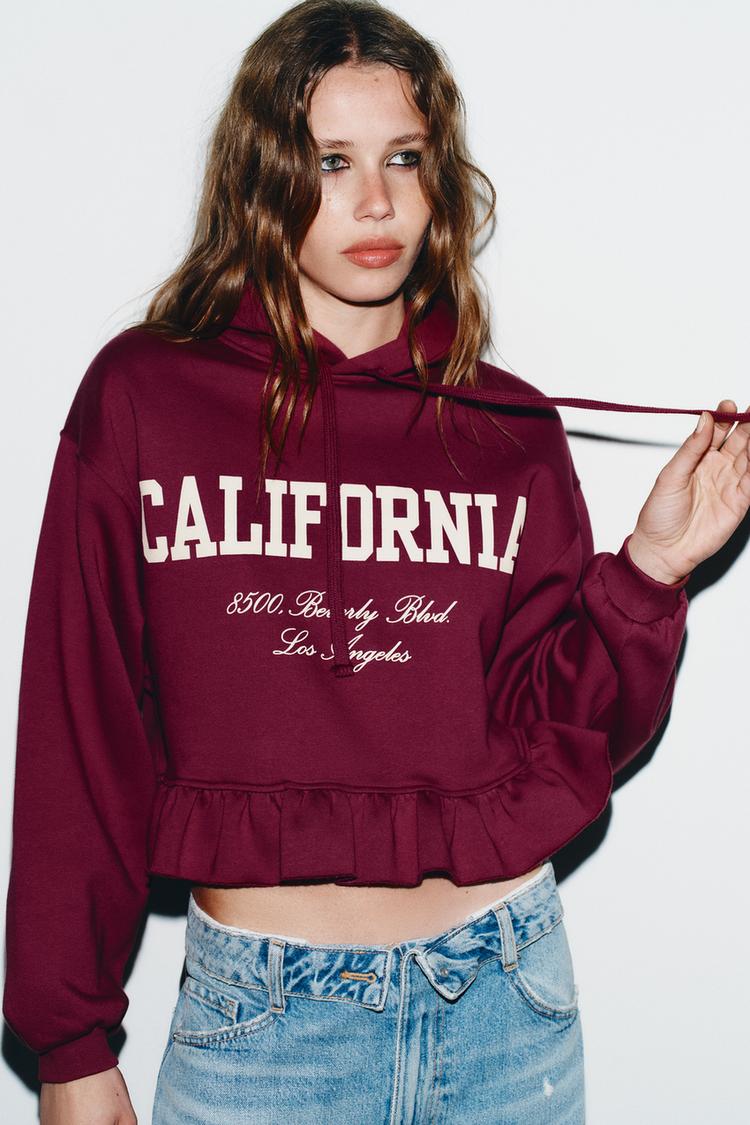 VARSITY SWEATSHIRT WITH RUFFLE TRIM