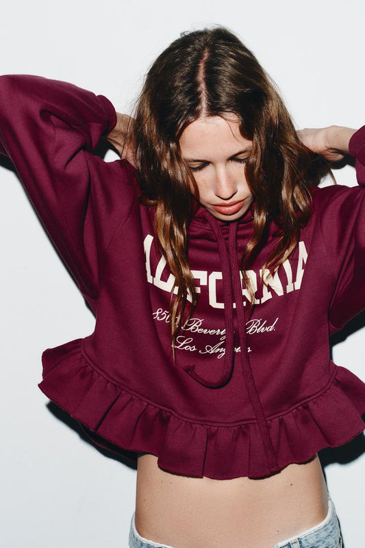 VARSITY SWEATSHIRT WITH RUFFLE TRIM