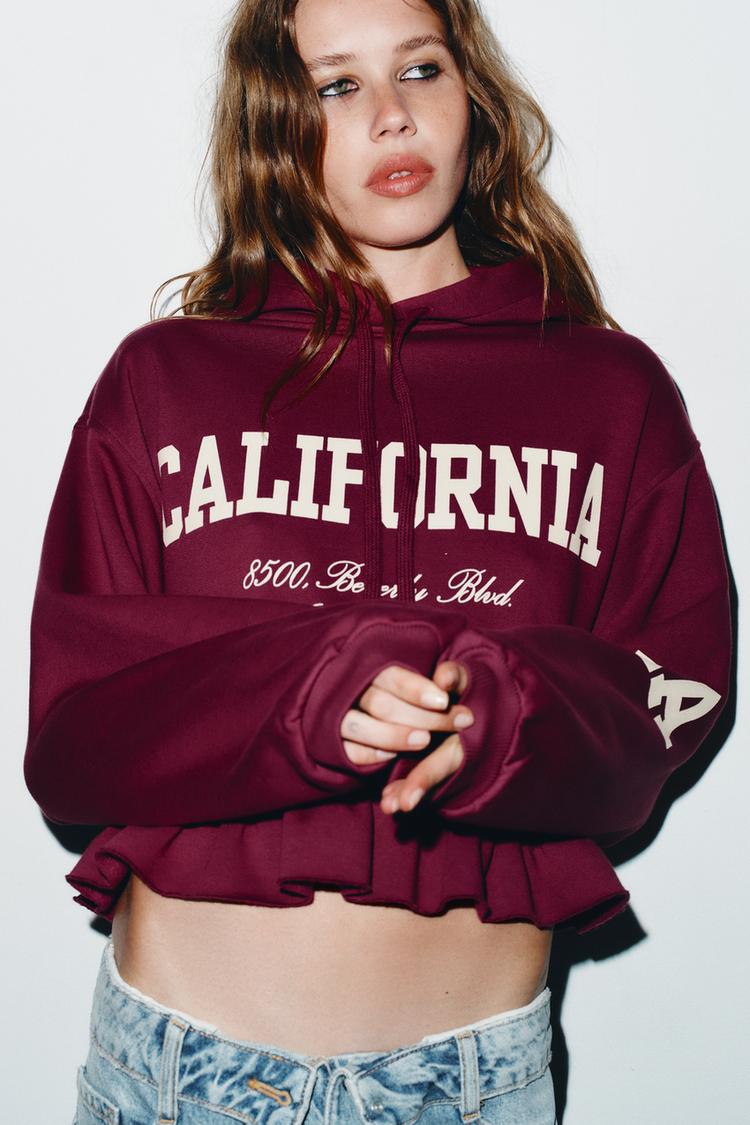 VARSITY SWEATSHIRT WITH RUFFLE TRIM
