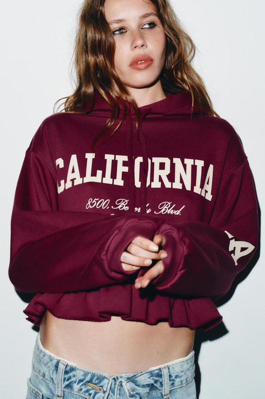 VARSITY SWEATSHIRT WITH RUFFLE TRIM