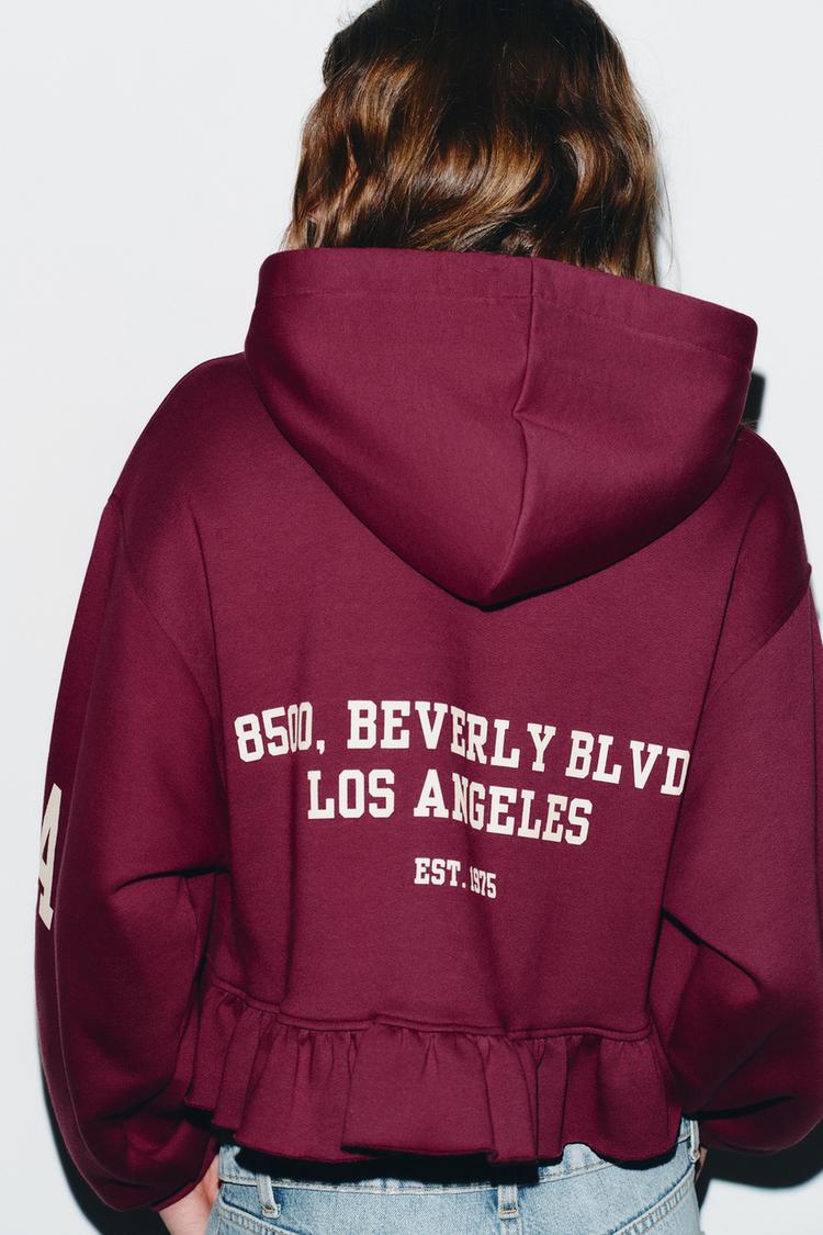 VARSITY SWEATSHIRT WITH RUFFLE TRIM